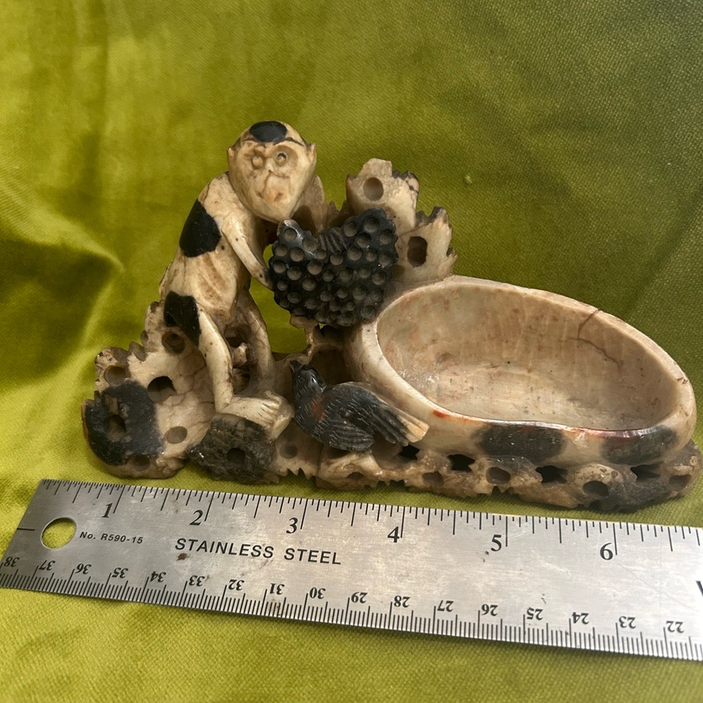 2 small carved figurines with reservoir/vase- monkey, bird, flowers